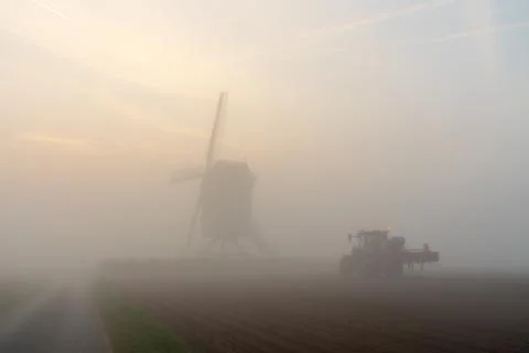 An Windmill in the fog Stock Photos
