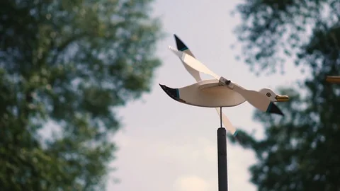 Windmill in the form of a duck with a propeller in a city park  Видео 108395470
