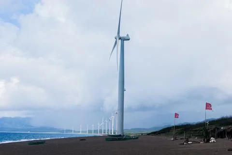 Windmill formation facing the sea 写真素材