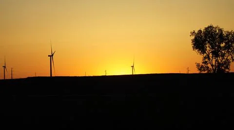 Windmill In Front of Beautiful Sunset Foto stock