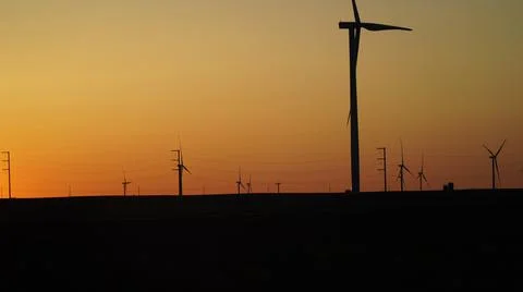Windmill In Front of Beautiful Sunset Foto stock