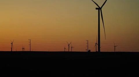 Windmill In Front of Beautiful Sunset Foto stock