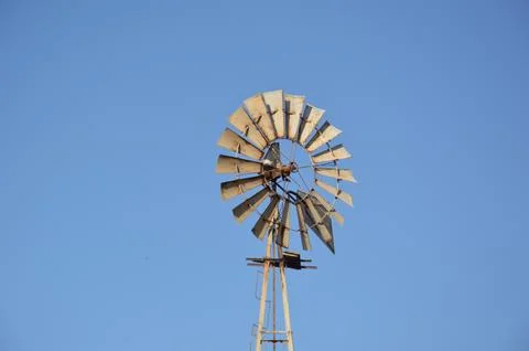 Windmill for generating electricity in the fields of Rhodes in Greece Stock Photos