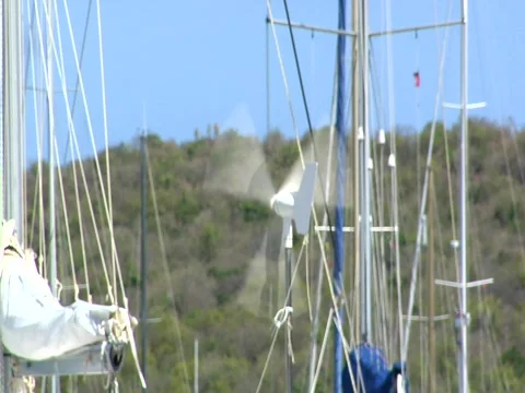 Windmill generator on boat in marina Stock Footage 709281