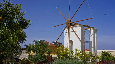Windmill in Greece with an airplane Stock Footage 267481094