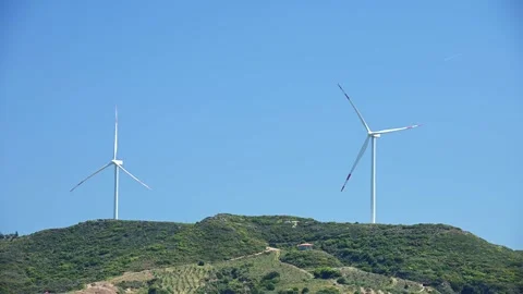 Windmill on a hill producing renewable energy Vídeos de archivo 254064697