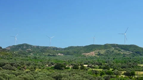 Windmill on a hill producing renewable energy from wind 動画素材 266839176