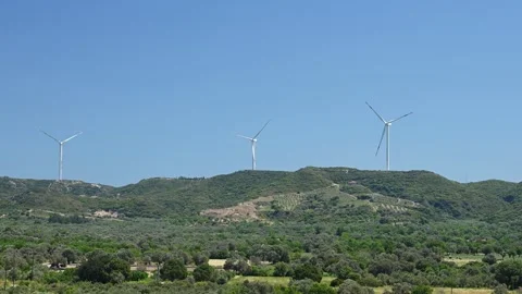 Windmill on a hill producing renewable energy from wind Видео 277116153