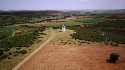 Windmill on the hill at sunset in Castilla la Mancha, Spain Stock Footage 234082832
