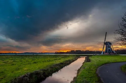 Windmill with a impressive sky Stock Photos