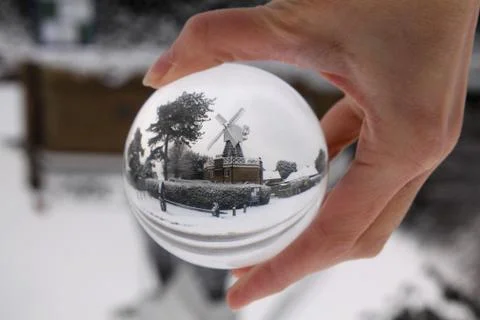 Windmill inside a glass ball Stock Photos