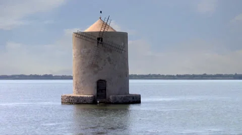 The windmill on the lagoon of orbetello Stock Footage 33622738