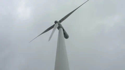Windmill low perspective pan shot slow-motion Stock Footage 117178994