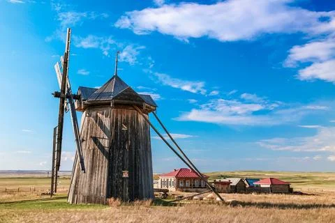 A windmill is in the middle of a field in Arkaim Ural Russia. Stock Photos