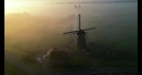 Windmill in the mist, The Netherlands Stock Footage 323043995