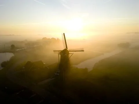 Windmill in the mist, The Netherlands Stock Photos
