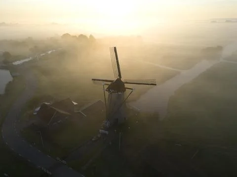 Windmill in the mist, The Netherlands Stock Photos