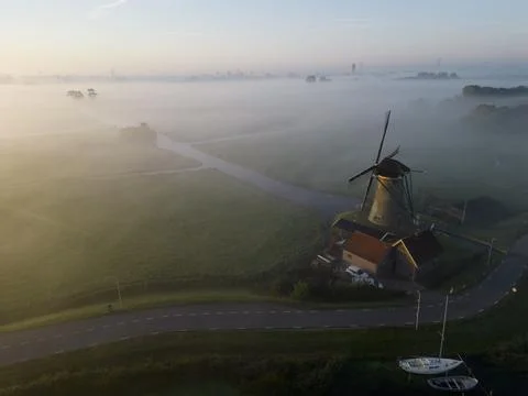 Windmill in the mist, The Netherlands Stock Photos