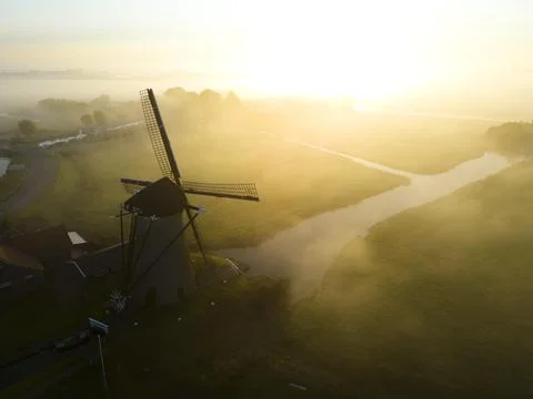 Windmill in the mist, The Netherlands Stock Photos