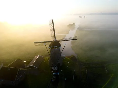 Windmill in the mist, The Netherlands Stock Photos