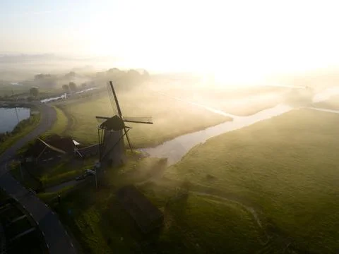 Windmill in the mist, The Netherlands Stock Photos