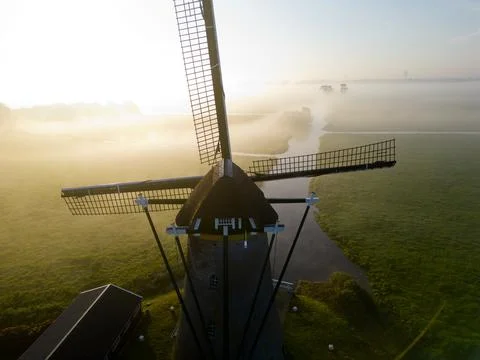 Windmill in the mist, The Netherlands Stock Photos