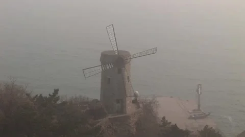 Windmill in misty China Video stock 43235606