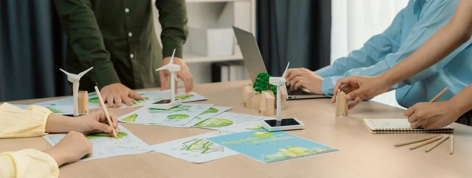 Windmill model and environmental document was placed at table. Delineation. Stock Photos