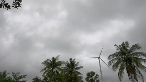 Windmill n wind turbine with blades on thunder rain storm cloud sky Stock Footage 167053877
