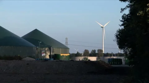 Windmill next to biogas installation Stock Footage 5700889