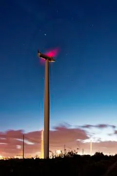 Windmill at night and cloudy sky Stock Photos
