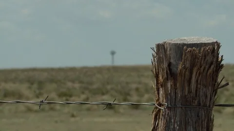 Windmill old Texas fence post Stock Footage 81606132