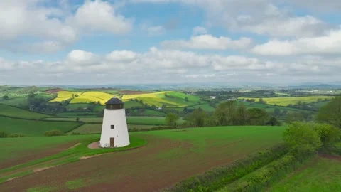 Windmill over fields and farms from a drone, Torquay, Devon, England 動画素材 255962262