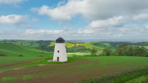 Windmill over fields and farms from a drone, Torquay, Devon, England 動画素材 255962283