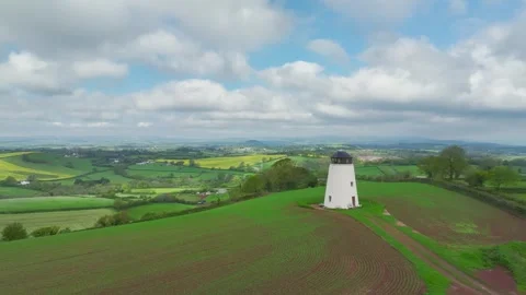 Windmill over fields and farms from a drone, Torquay, Devon, England 動画素材 255962293