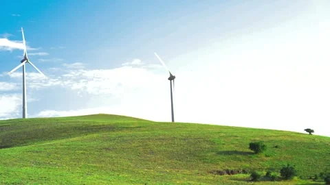 Windmill over green hill, sunny day and tree is in the corner 스톡 동영상 246366331