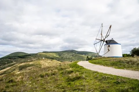 Windmill overlooking distant valleys and plains Stock Photos