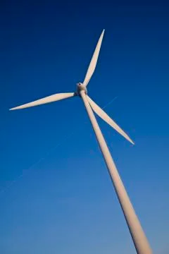 Windmill with plane trail Stock Photos