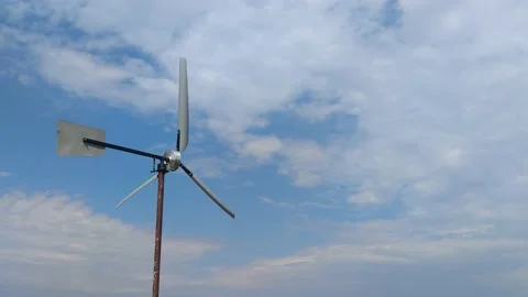 Windmill Power Generator Fan, Under Blue Sky, Shown as Power Industry Concept.  Stock Footage 204919439