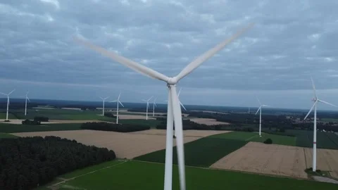 Windmill producing renewable energy - scenic video Stock Footage 157480026