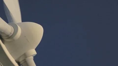 Windmill, propeller shot from low angle, panning into dark blue sky Stock Footage 85562215