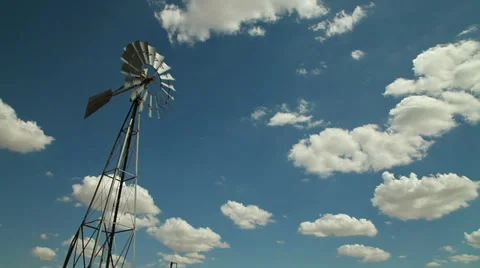 A windmill in a remote area of a western desert Stock Footage 33898572