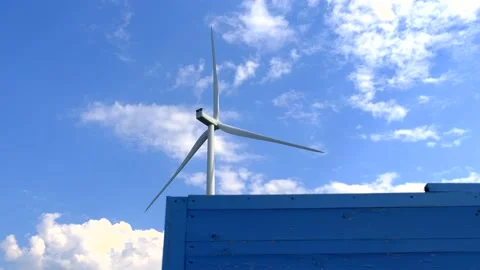 A windmill that rotates under the influence of wind and generates renewable Stock-Footage 163742398