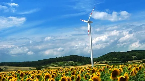 Windmill is rotating during windy summer cloudy day Stock Footage 98957281
