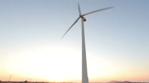 Windmill rotating on sunrise Stock Footage 67677118