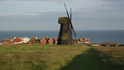 Windmill at the seaside on the hill in England Stock Footage 76810342