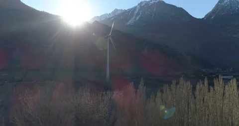 Windmill shadow on trees, approach, Vernayaz - Aerial 4K Stock Footage 104814819