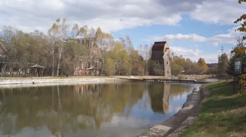 Windmill on the shore of the pond Stock Footage 31445747