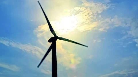 Windmill Silhouette on Cloudy Blue Sky Background Stock Footage 142389125