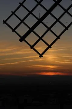 Windmill Silhouette at Sunset Stock Photos